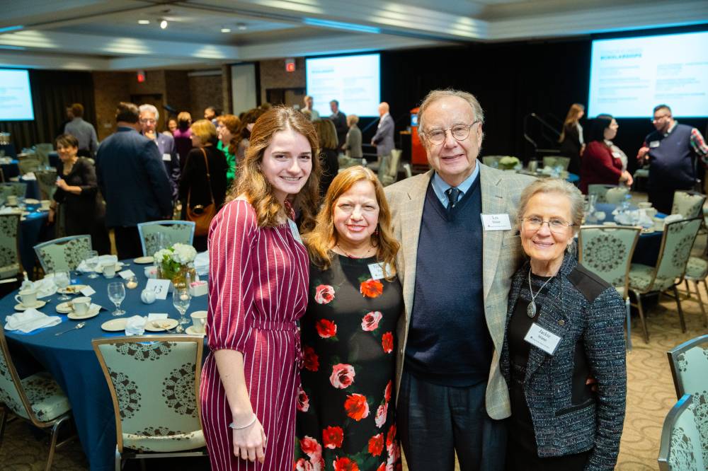 Donors posing with a student at Scholarship Dinner 2019